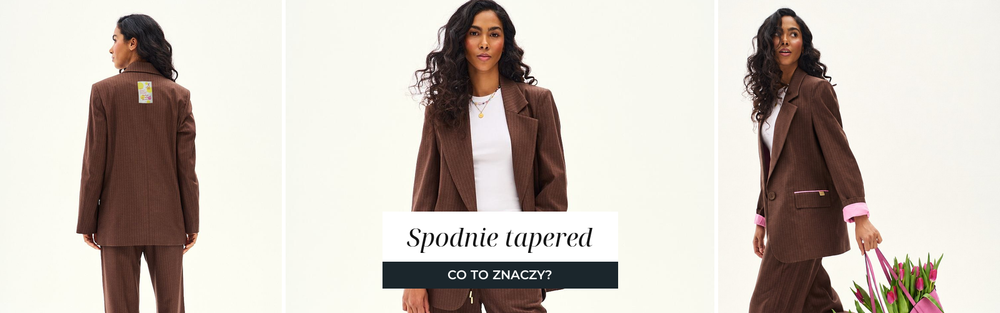 Kobieta w brązowym komplecie z marynarką i spodniami o nogawce zwężanej ku kostce.